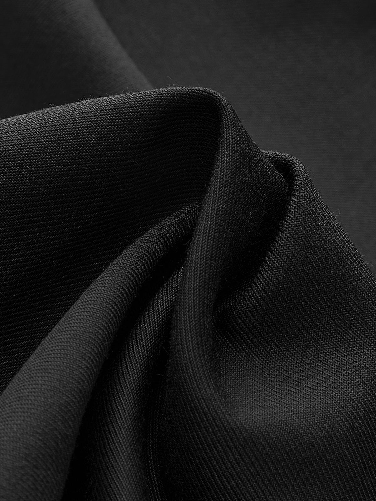 Plati kelnės su mygtuku asimetriniame krašte